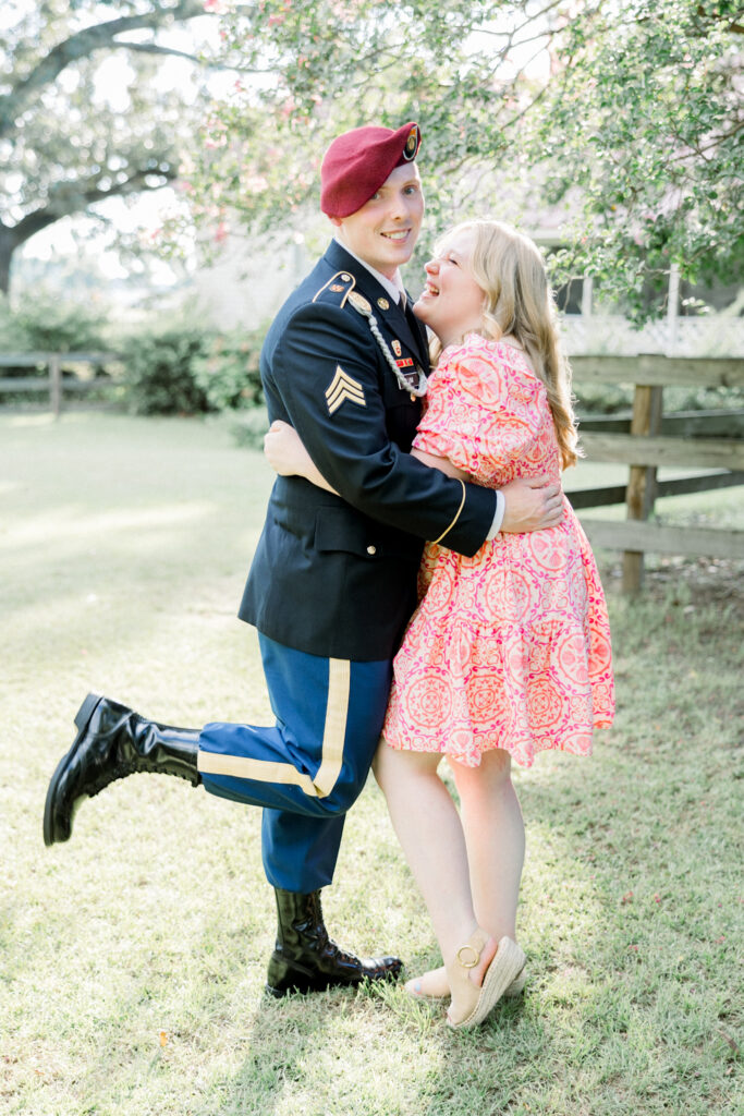 Bride-to-be laughing while fiancé is silly and fun at Gillis Hill Farm engagement session.