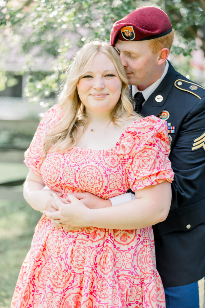 Couple standing together at Gillis Hill Farm in Fayetteville, NC during their rustic summer engagement session.