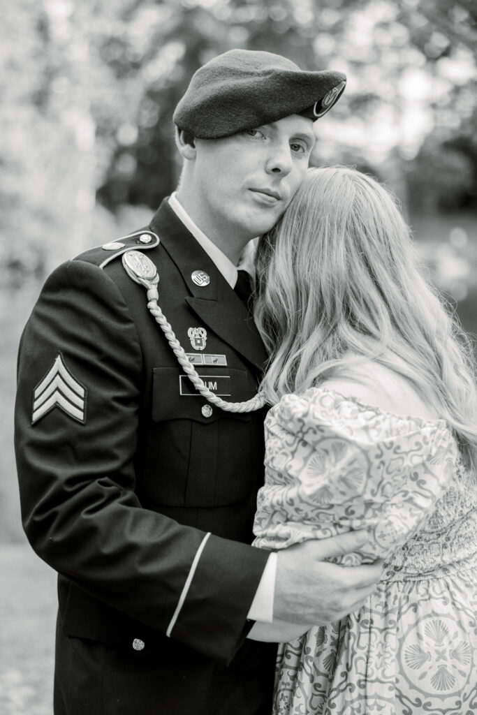 Couple standing together at Gillis Hill Farm in Fayetteville, NC during their rustic summer engagement session.