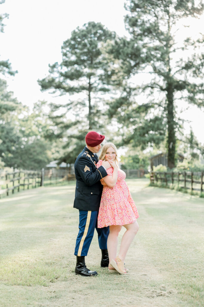 Couple standing together at Gillis Hill Farm in Fayetteville, NC during their rustic summer engagement session.