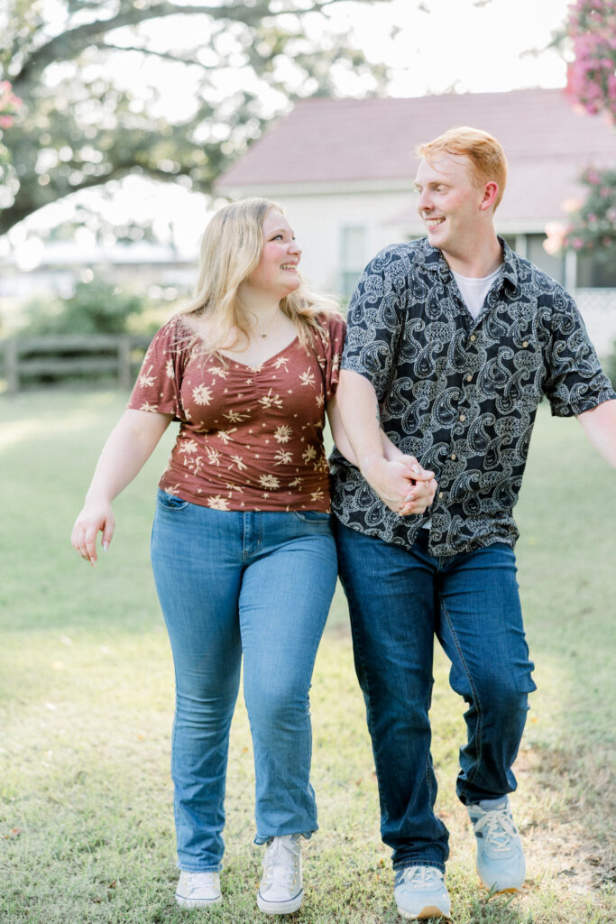 Bumping hips and having lots of joy and laughter during this hot summer engagement session in Fayetteville, North Carolina