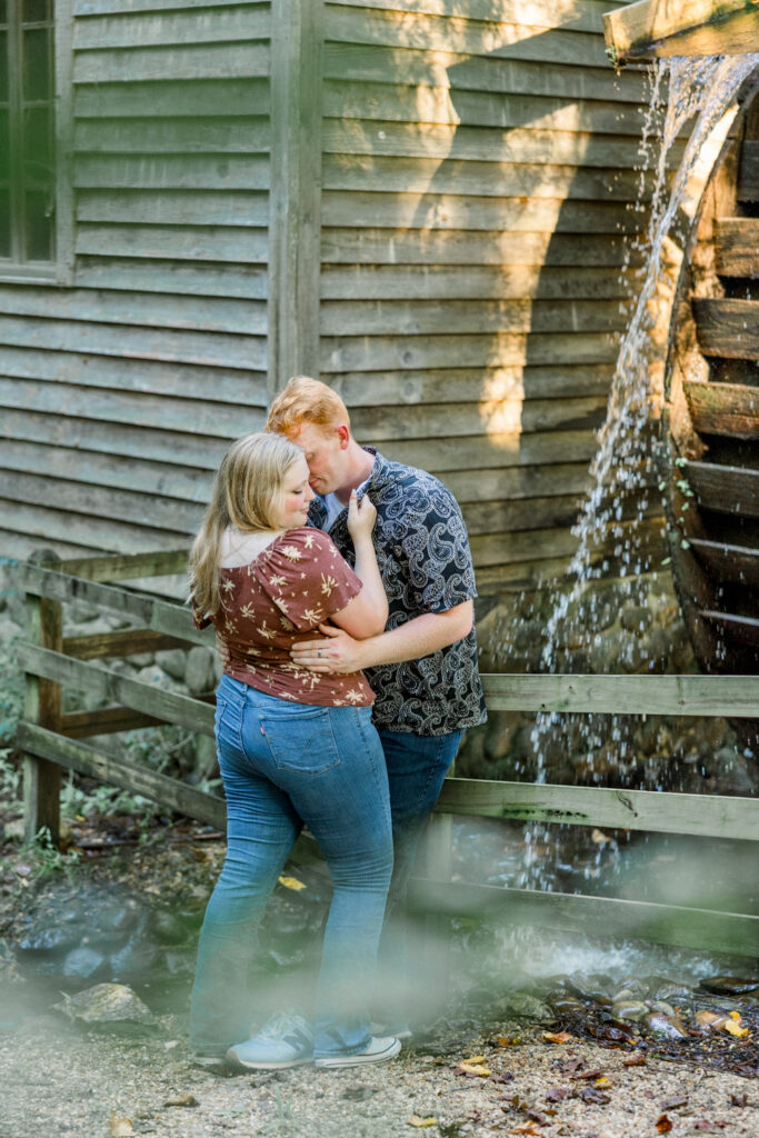 Couple standing together at Gillis Hill Farm in Fayetteville, NC during their rustic summer engagement session.