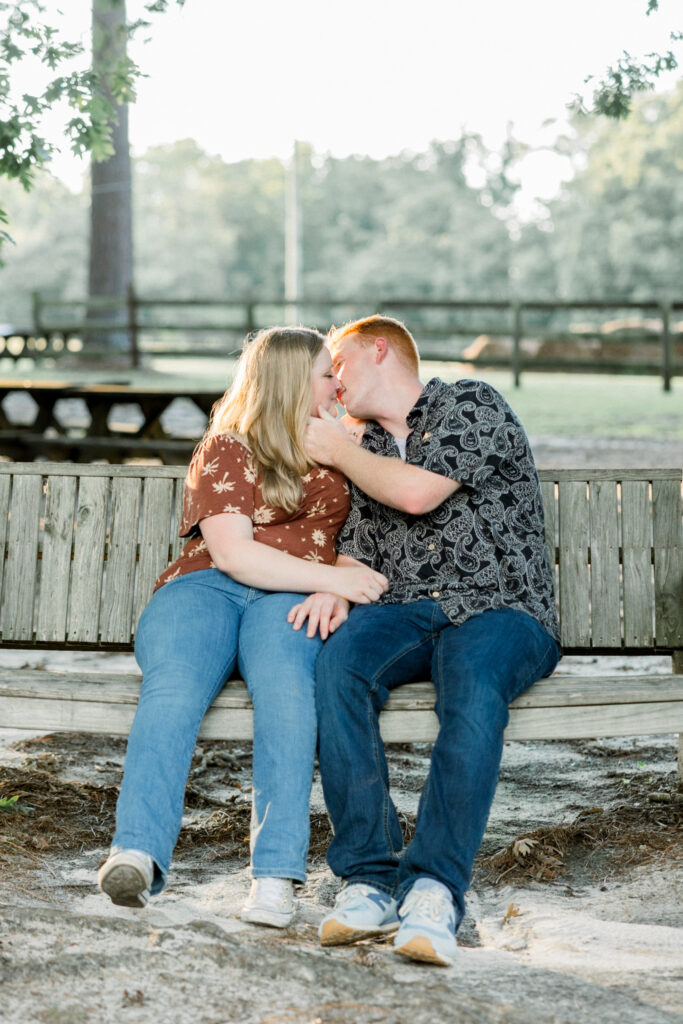 Romantic swing kisses during the sunset glow at Gillis Hill Farm