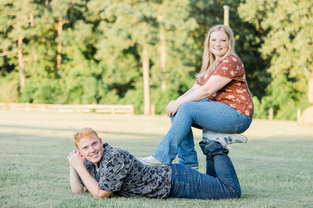 Fun posing of bride-to-be and fiancé during their farm engagement session at Gillis Hill Farm