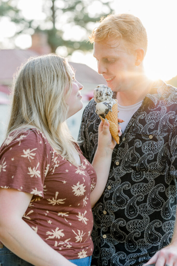 Bride-to-be and fiancé enjoying ice cream after a hot summer engagement session in Fayetteville, North Carolina