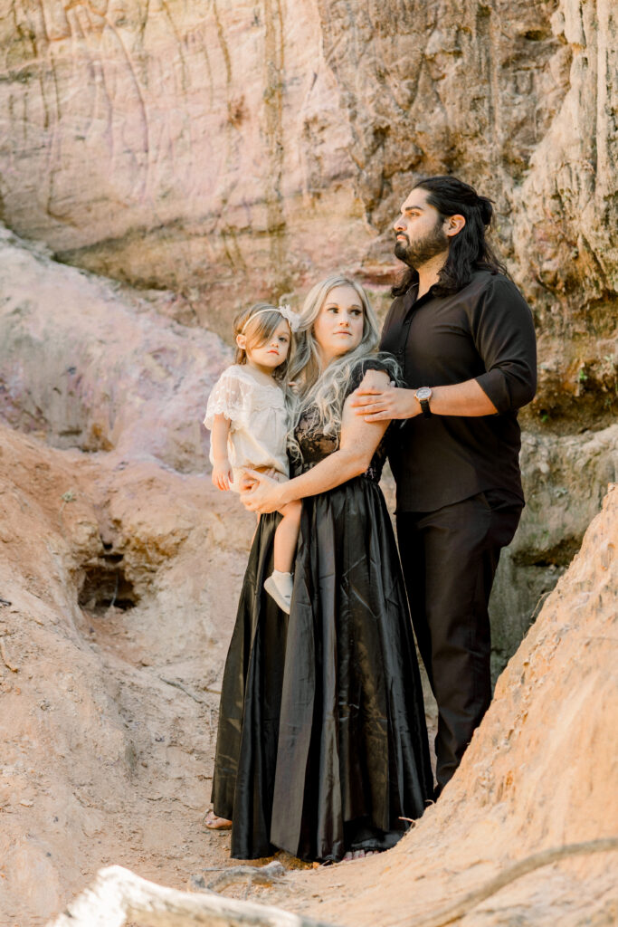 Family in red clay canyon in Georgia