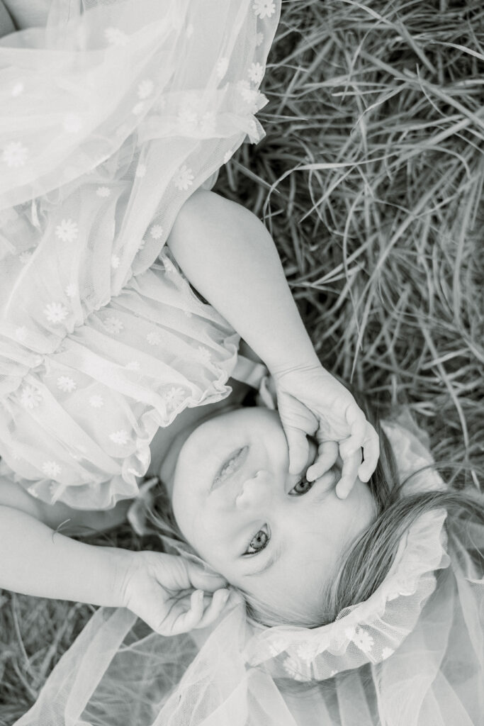 Laying in the grass during family portraits
