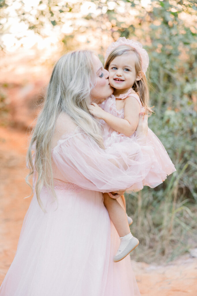 Mother and daughter smiling during family photo session